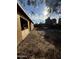 A view of a large, undeveloped backyard with adjacent construction framing and yard access at 4418 N 19Th Pl, Phoenix, AZ 85016