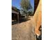 A view of the spacious backyard featuring desert plants and a wood fence around the perimeter at 4418 N 19Th Pl, Phoenix, AZ 85016