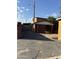 View of the property's partially constructed garage and carport showing framing and backyard access at 4418 N 19Th Pl, Phoenix, AZ 85016