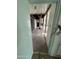 Hallway view showing exposed framing, ceiling damage, and debris on the floor from ongoing renovations at 4418 N 19Th Pl, Phoenix, AZ 85016