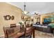 Open floor plan of dining area flowing to kitchen and living room for a seamless transition at 4821 E Kirkland Rd, Phoenix, AZ 85054