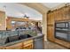 Stylish kitchen with custom cabinetry, granite countertops, and a sink with a view to the adjacent living spaces at 4821 E Kirkland Rd, Phoenix, AZ 85054