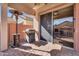 Covered patio featuring a grill and heater with a view of the outdoor fireplace at 4821 E Kirkland Rd, Phoenix, AZ 85054