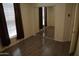 Bright bedroom featuring an expansive closet, large window, and hardwood flooring at 5720 S 21St Ter, Phoenix, AZ 85040