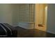 Bedroom with ensuite bathroom access and unique glass block partition feature at 5720 S 21St Ter, Phoenix, AZ 85040