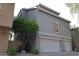 Rear exterior featuring a two-car garage and neutral paint at 5720 S 21St Ter, Phoenix, AZ 85040