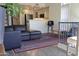 Cozy living room featuring hardwood floors and opening into the kitchen with stainless steel appliances at 5720 S 21St Ter, Phoenix, AZ 85040
