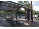 Community pool area featuring picnic tables and shade at 5720 S 21St Ter, Phoenix, AZ 85040