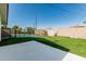 Large backyard featuring a refreshing pool, lush green lawn, and concrete patio area at 591 N Cheri Lynn Dr, Chandler, AZ 85225