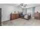 Comfortable bedroom showcasing a bed, two dressers, carpet flooring, and a ceiling fan with light at 591 N Cheri Lynn Dr, Chandler, AZ 85225