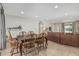 Open-concept dining room with wood table, chairs, and seamless flow to the living area at 591 N Cheri Lynn Dr, Chandler, AZ 85225