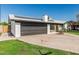 Beautiful single-story home with a well-manicured lawn and mature trees at 591 N Cheri Lynn Dr, Chandler, AZ 85225