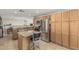 Well-equipped kitchen featuring granite countertops, stainless steel appliances, and convenient island seating at 591 N Cheri Lynn Dr, Chandler, AZ 85225