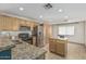 Stylish kitchen with stainless steel appliances, granite countertops, and ample cabinetry for storage at 591 N Cheri Lynn Dr, Chandler, AZ 85225