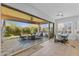 Open dining area with large glass doors leading to the covered patio at 6948 E Quill St, Mesa, AZ 85207