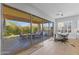 Open dining area with large glass doors leading to the covered patio at 6948 E Quill St, Mesa, AZ 85207