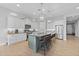 Bright kitchen boasts modern appliances, an island with seating, and ample cabinet space at 6948 E Quill St, Mesa, AZ 85207