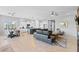 Spacious living room with an open floor plan, flowing into the dining area and kitchen at 6948 E Quill St, Mesa, AZ 85207