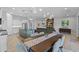 Open concept living space featuring modern kitchen with dining area and a stylish living room at 6948 E Quill St, Mesa, AZ 85207