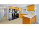 Bright kitchen features light wood cabinets, a black appliance package, and light backsplash at 747 E Germann Rd # 15, San Tan Valley, AZ 85140