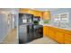 Bright kitchen features light wood cabinets, a black appliance package, and light backsplash at 747 E Germann Rd # 15, San Tan Valley, AZ 85140
