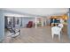 Spacious living room with hardwood floors and large windows providing ample natural light throughout the space at 747 E Germann Rd # 15, San Tan Valley, AZ 85140