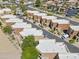 Aerial view featuring similar styled units with landscaped yards, parking, and mature trees throughout the community at 7601 E Roosevelt St # 1012, Scottsdale, AZ 85257