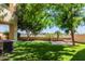 Beautiful backyard with lush artificial turf, pavers, and a cozy fire pit at 7601 E Roosevelt St # 1012, Scottsdale, AZ 85257