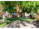 Beautiful backyard with lush artificial turf, pavers, covered patio and outdoor grill at 7601 E Roosevelt St # 1012, Scottsdale, AZ 85257