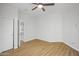 Bedroom featuring wood-look floors and a closet with sliding doors at 7601 E Roosevelt St # 1012, Scottsdale, AZ 85257