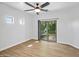 Bright bedroom features a ceiling fan and sliding glass doors to a balcony at 7601 E Roosevelt St # 1012, Scottsdale, AZ 85257