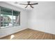 Bedroom featuring wood-look floors and a large view of the city at 7601 E Roosevelt St # 1012, Scottsdale, AZ 85257