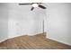 Well-lit bedroom features wood-look floors and fresh white paint at 7601 E Roosevelt St # 1012, Scottsdale, AZ 85257