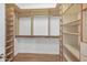 Walk-in closet features custom shelving and hanging rods at 7601 E Roosevelt St # 1012, Scottsdale, AZ 85257