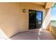 Outdoor patio with stucco exterior and a sliding glass door at 7601 E Roosevelt St # 1012, Scottsdale, AZ 85257