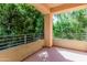 Covered outdoor patio with lush green trees and greenery creating a serene space at 7601 E Roosevelt St # 1012, Scottsdale, AZ 85257