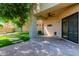 Covered patio with lush artificial turf, pavers and access to the backyard at 7601 E Roosevelt St # 1012, Scottsdale, AZ 85257