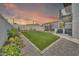 Spacious backyard with manicured lawn, lush garden beds and block fence for privacy at 8436 N 13Th N Pl, Phoenix, AZ 85020