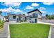 Expansive backyard with artificial turf, modern design, deck and attached two car garage at 8436 N 13Th N Pl, Phoenix, AZ 85020