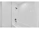 Bright bathroom showcasing a clean, white subway-tiled shower and tub combo at 8436 N 13Th N Pl, Phoenix, AZ 85020