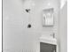 Modern bathroom with white subway tile, walk-in shower, black hardware, and a stylish vanity at 8436 N 13Th N Pl, Phoenix, AZ 85020