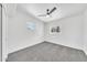 Bedroom with carpet floors, two windows, and a ceiling fan at 8436 N 13Th N Pl, Phoenix, AZ 85020