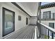Spacious covered deck with wood flooring and a modern railing system at 8436 N 13Th N Pl, Phoenix, AZ 85020