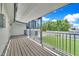 Covered deck overlooking a beautiful backyard featuring artificial turf and plants at 8436 N 13Th N Pl, Phoenix, AZ 85020