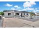 Pleasant home featuring a neutral-toned facade, a well-kept yard, and a paved driveway at 8436 N 13Th N Pl, Phoenix, AZ 85020