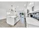 Stylish kitchen with white cabinets, stainless steel appliances, an island, and an open floor plan at 8436 N 13Th N Pl, Phoenix, AZ 85020