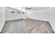 Spacious living room with wood-look flooring, recessed lighting, and mountain view windows at 8436 N 13Th N Pl, Phoenix, AZ 85020