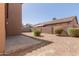 Spacious backyard with partial landscaping and low brick fence at 8928 E Crescent Ave, Mesa, AZ 85208