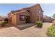 Rear exterior view of two-story home with patio and desert landscaping at 8928 E Crescent Ave, Mesa, AZ 85208