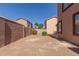 Fenced backyard featuring desert landscaping with privacy wall at 8928 E Crescent Ave, Mesa, AZ 85208